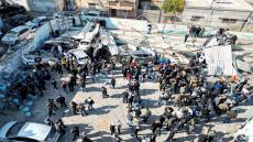 Palestinians inspect the damage following an Israeli raid in Jenin in the Israeli-occupied West Bank January 26, 2023. REUTERS/Mohamad Torokman